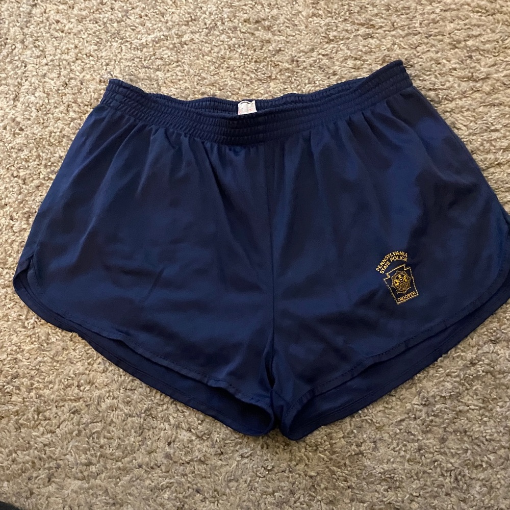 Woman’s large running shorts with PA State Police Trooper emblem. Fair condition